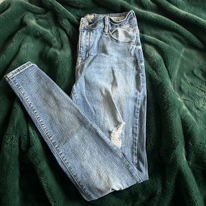 Pacsun high rise skinniest distressed denim. Distressed on both legs.